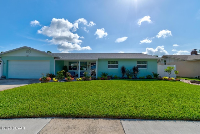 2917 Carriage Dr, South Daytona, FL 32119 - ranch-style house featuring an attached garage, a front yard, and concrete driveway