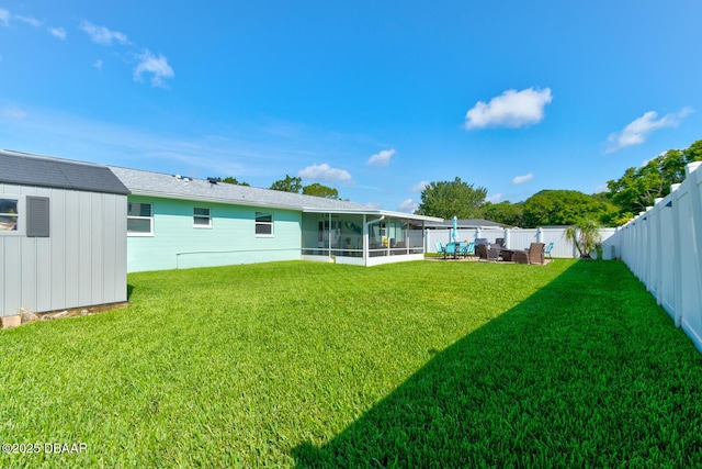 2917 Carriage Dr, South Daytona, FL 32119 - fenced backyard featuring a sunroom