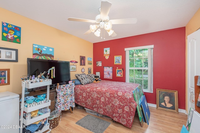 715 Unabelle Ave, Holly Hill, FL 32117 - bedroom with wood finished floors, baseboards, and a ceiling fan