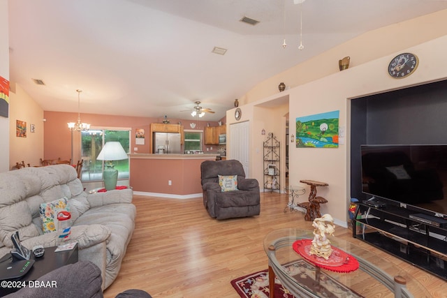 715 Unabelle Ave, Holly Hill, FL 32117 - living area with a ceiling fan, light wood-style flooring, a chandelier, lofted ceiling, and baseboards