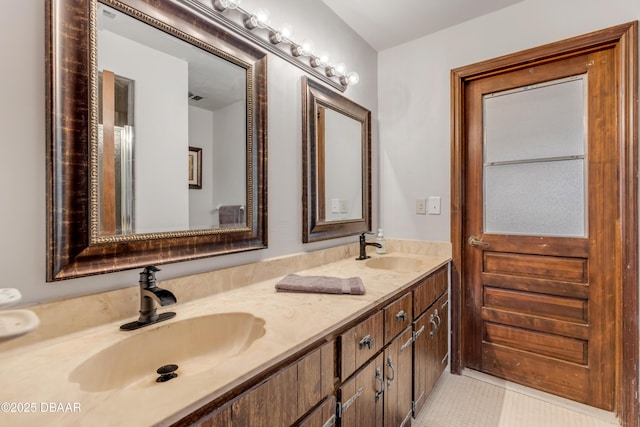 bathroom featuring tile patterned flooring and vanity