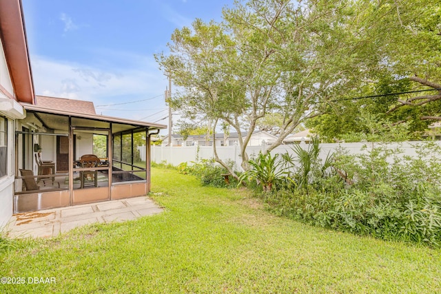 view of yard featuring a sunroom