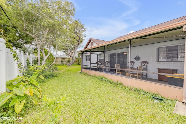 view of yard featuring a sunroom