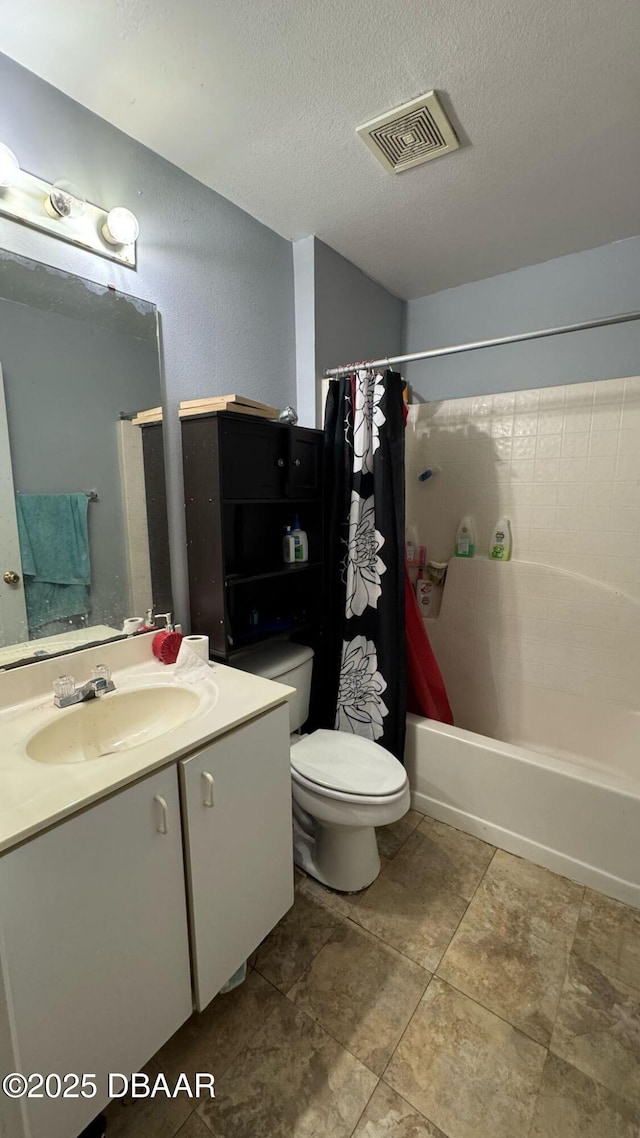 full bathroom with visible vents, toilet, vanity, and a textured ceiling