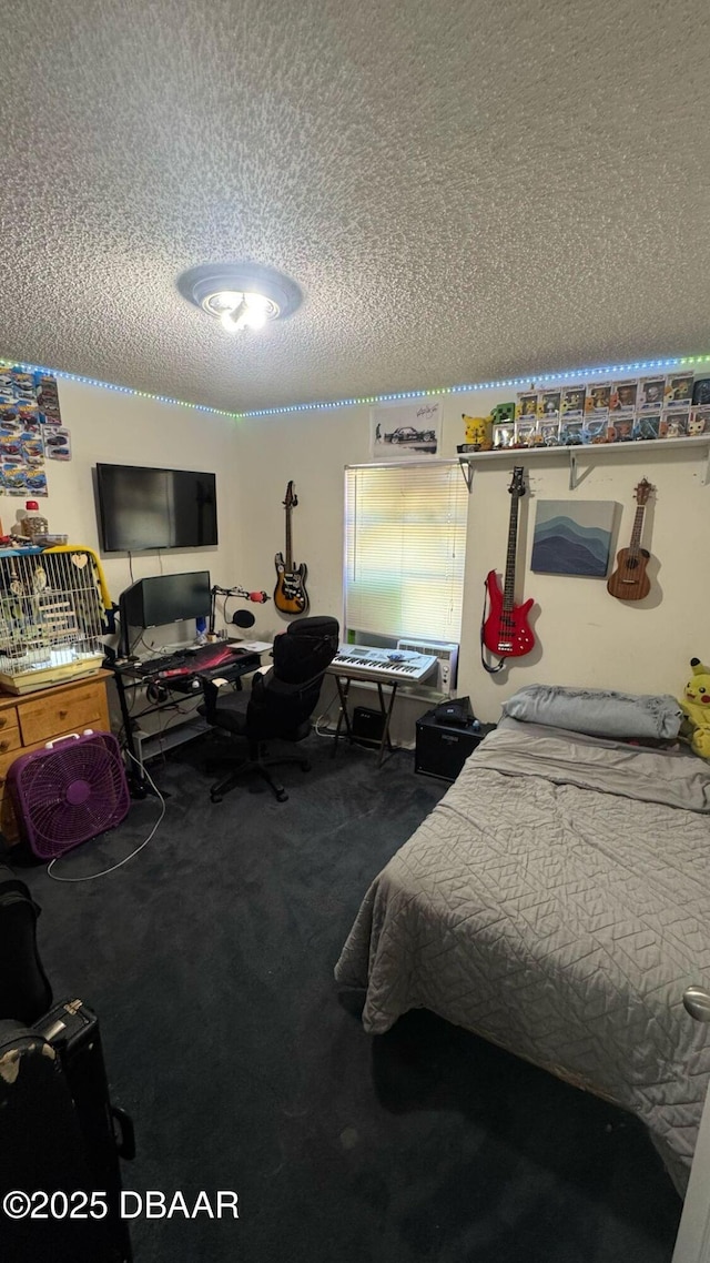 bedroom with carpet floors and a textured ceiling