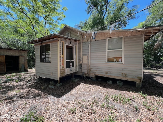 1412 Wood St, Deland, FL 32724 - view of front facade with an outdoor structure