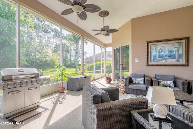 sunroom featuring ceiling fan