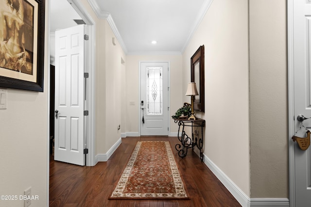 foyer entrance featuring ornamental molding and dark hardwood / wood-style flooring