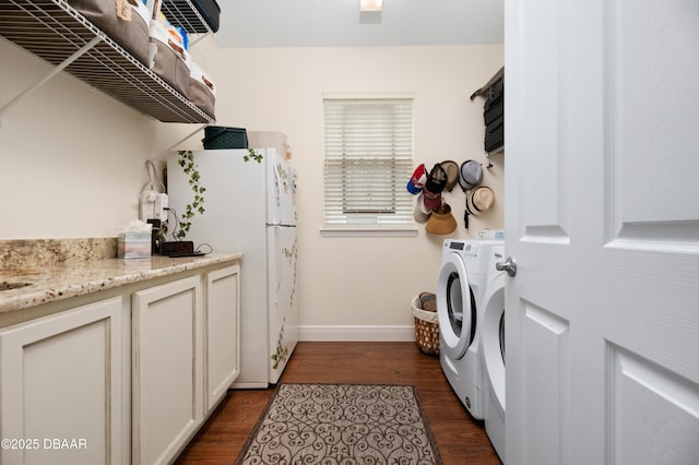 washroom featuring washer / dryer and dark hardwood / wood-style flooring