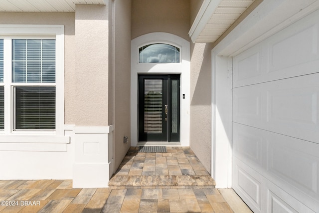 doorway to property featuring a garage