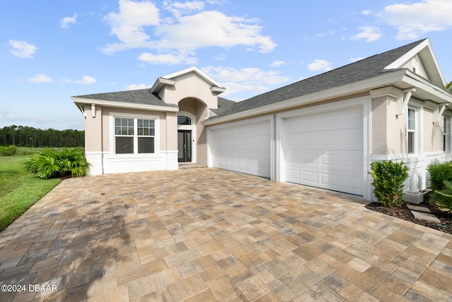 view of front of property with a garage