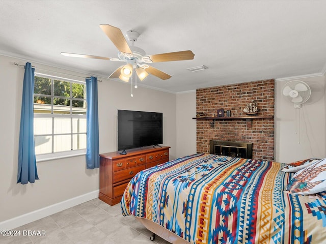 bedroom featuring visible vents, crown molding, baseboards, ceiling fan, and light tile patterned flooring