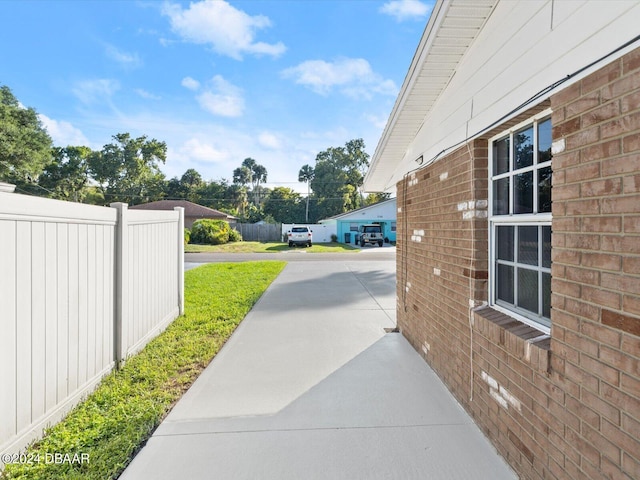 exterior space with fence and driveway