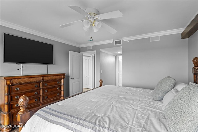 bedroom featuring ornamental molding, ceiling fan, and a closet