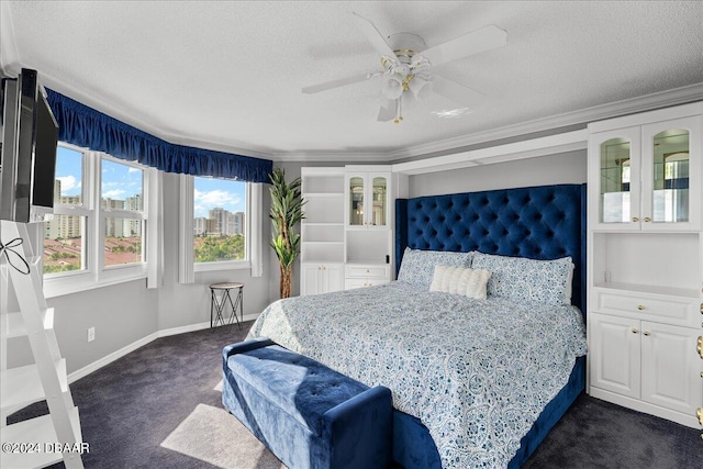 carpeted bedroom featuring a textured ceiling, ceiling fan, and crown molding