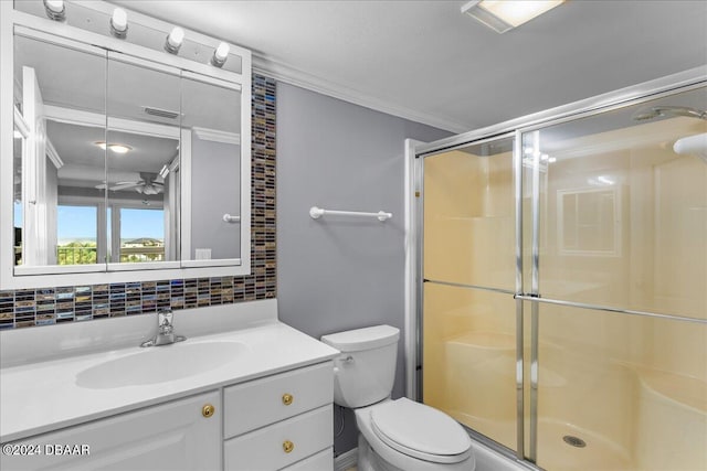 bathroom with ornamental molding, vanity, an enclosed shower, toilet, and ceiling fan