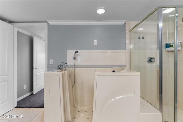 bathroom featuring tile patterned flooring, ornamental molding, and separate shower and tub