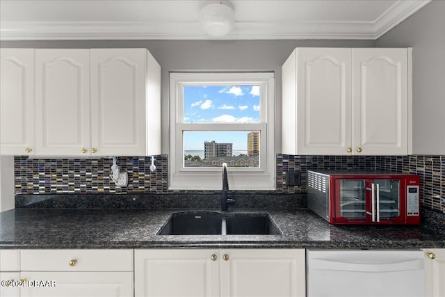 kitchen featuring decorative backsplash, white cabinetry, sink, and white dishwasher