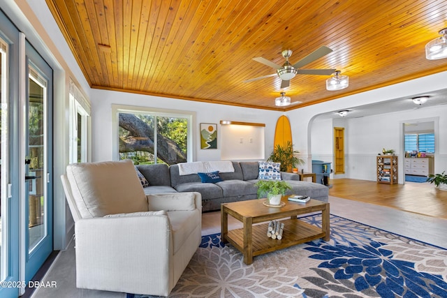 2300 Lake Ruby Rd, Deland, FL 32724 - living area with wooden ceiling, arched walkways, wainscoting, ceiling fan, and crown molding