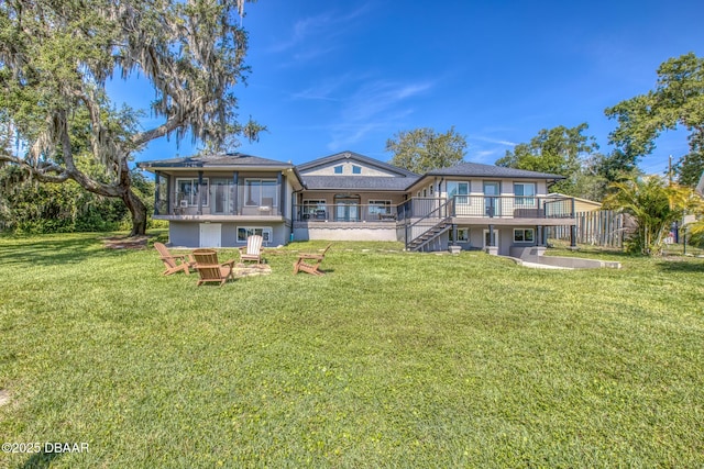 2300 Lake Ruby Rd, Deland, FL 32724 - back of property featuring stairway, a lawn, and a wooden deck