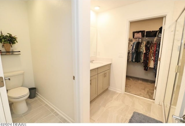 bathroom with toilet and vanity