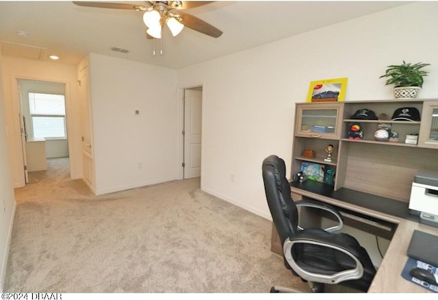 office with light colored carpet and ceiling fan