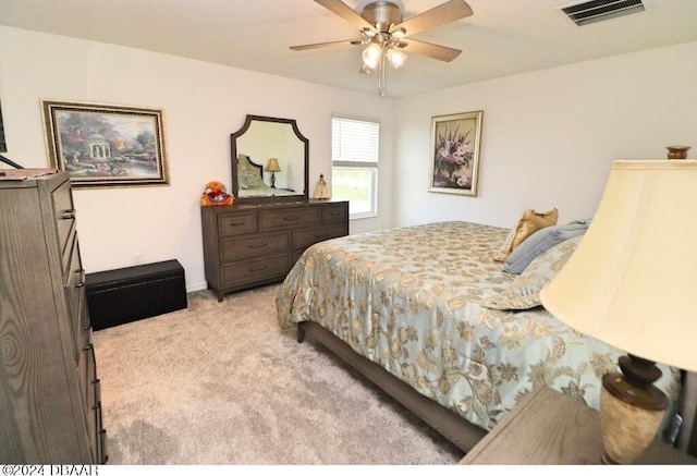 bedroom with light carpet and ceiling fan