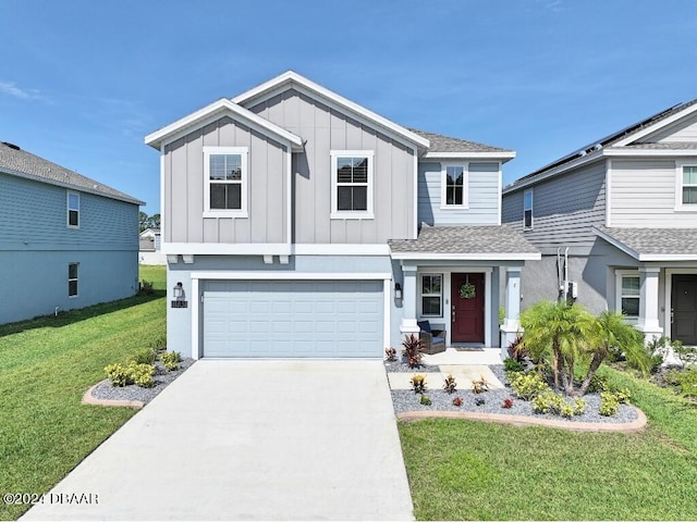 view of front of house with a garage and a front yard