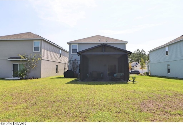 back of house with a yard