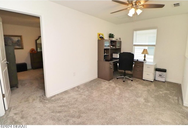 office with light colored carpet and ceiling fan