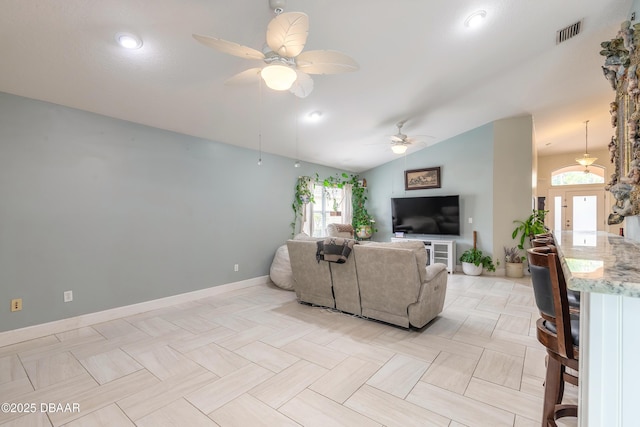 living room with vaulted ceiling and ceiling fan