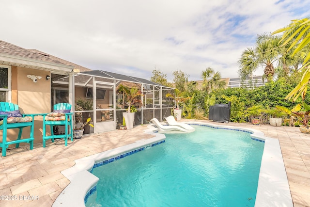 view of pool featuring a lanai and a patio