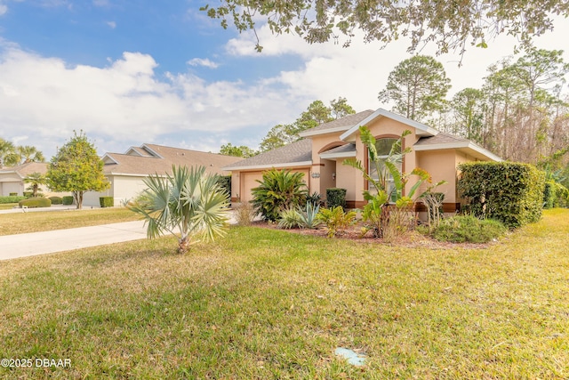 view of front of house with a garage and a front lawn