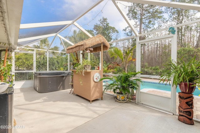 view of patio with a pool with hot tub and glass enclosure