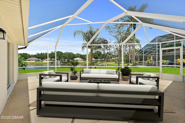view of patio with an outdoor living space, glass enclosure, and a water view