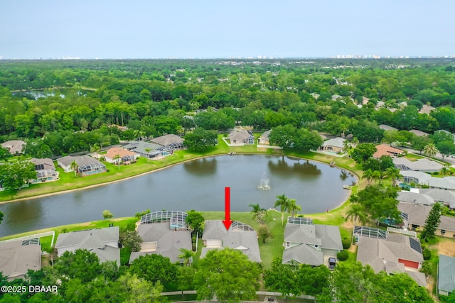 aerial view of residential area featuring a nearby body of water