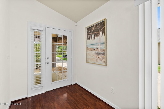 entryway with vaulted ceiling, dark wood-style flooring, and baseboards