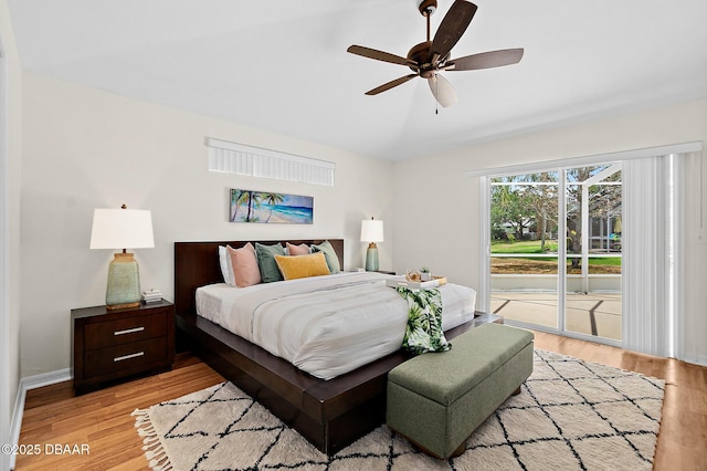 bedroom with access to outside, light wood-type flooring, baseboards, and a ceiling fan