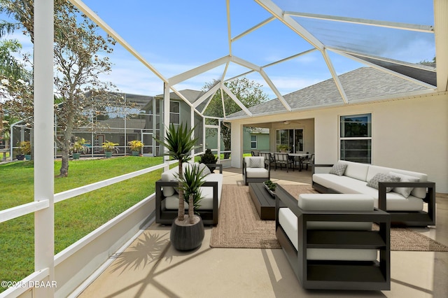 sunroom / solarium with an outdoor living space, a ceiling fan, healthy amount of natural light, and outdoor dining space
