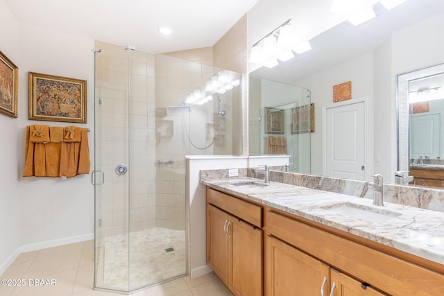 bathroom featuring vanity, tile patterned floors, and a shower with door