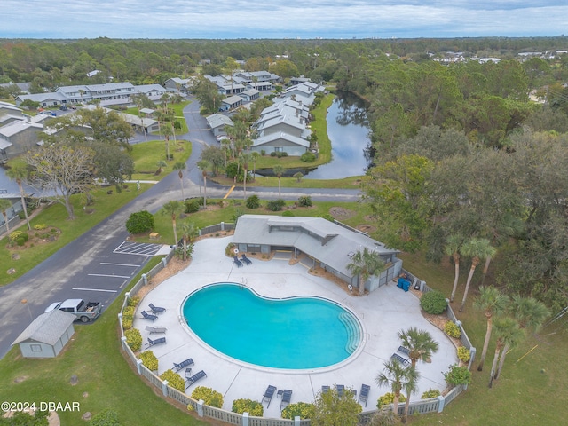 view of swimming pool featuring a water view