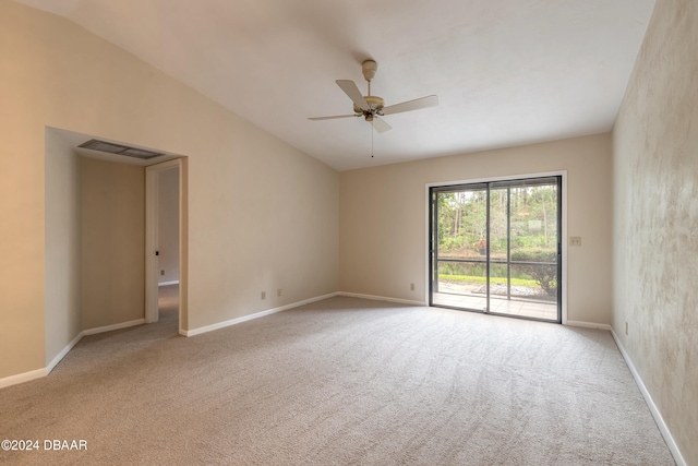 unfurnished room with light colored carpet, vaulted ceiling, and ceiling fan