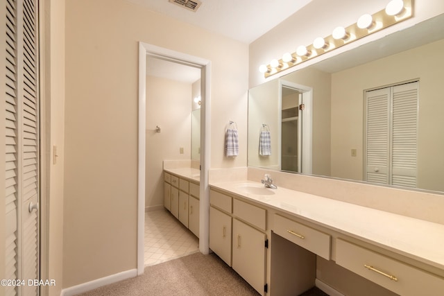 bathroom with vanity and tile patterned floors