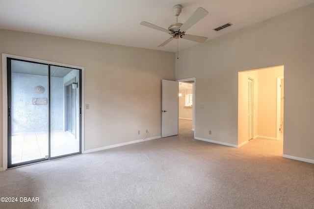 unfurnished bedroom with access to outside, light colored carpet, and ceiling fan