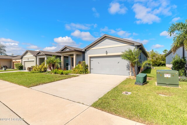 ranch-style home with a front lawn and a garage