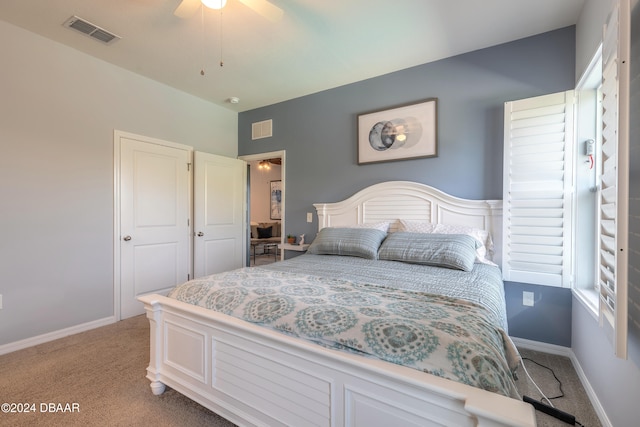 bedroom with light colored carpet and ceiling fan