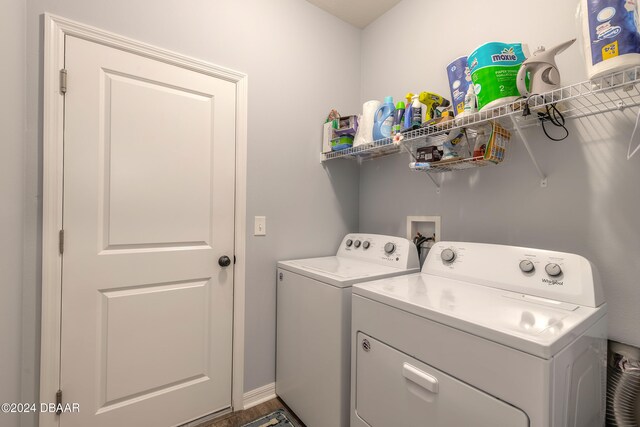 clothes washing area featuring washer and dryer