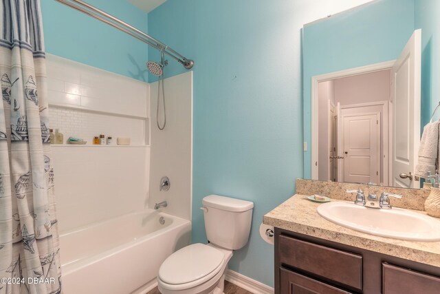 full bathroom featuring vanity, toilet, and shower / bathtub combination with curtain