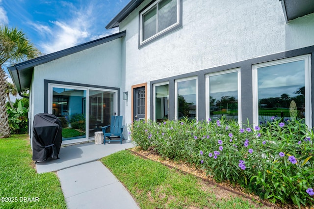 back of property with a patio