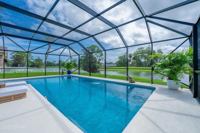 view of swimming pool with a water view, glass enclosure, and a patio area